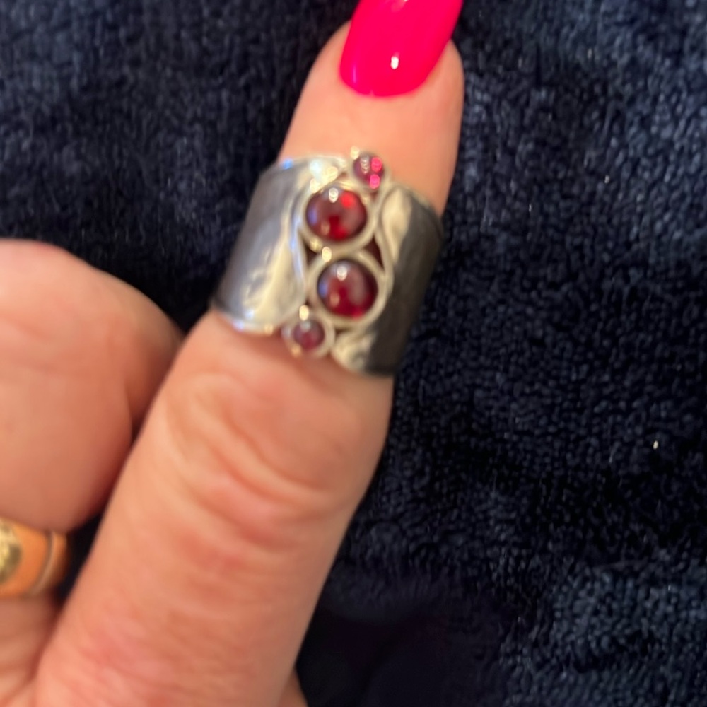 Silpada sterling ring with garnet stones.